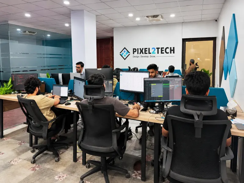 Inside the Pixel2Tech studio — team working at their desks